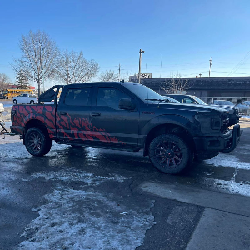 truck with custom paint job and dark tint