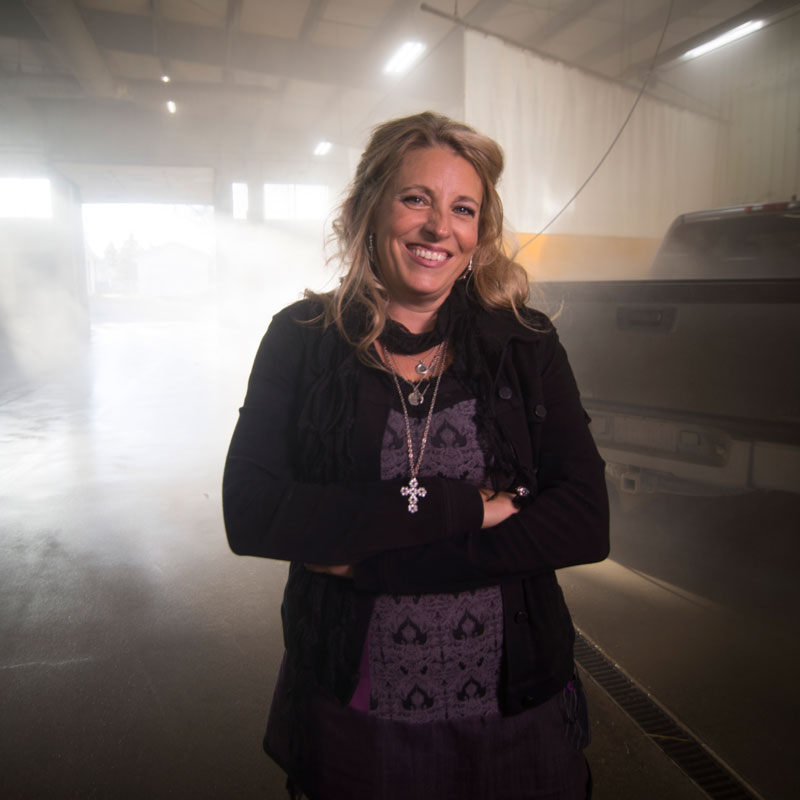 Shelley Gordon standing inside self service carwash area